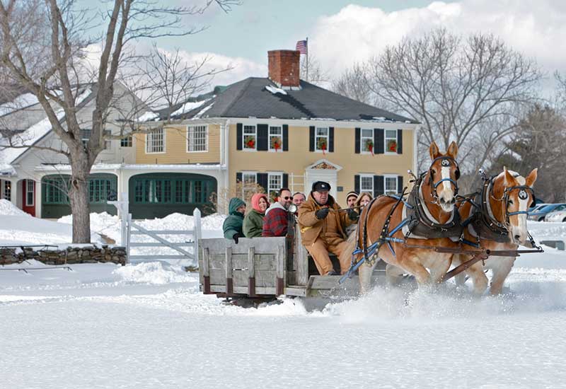 fireplaceFeastInsetHorses Horse-drawn sled ride through the snow near Salem Cross Inn.